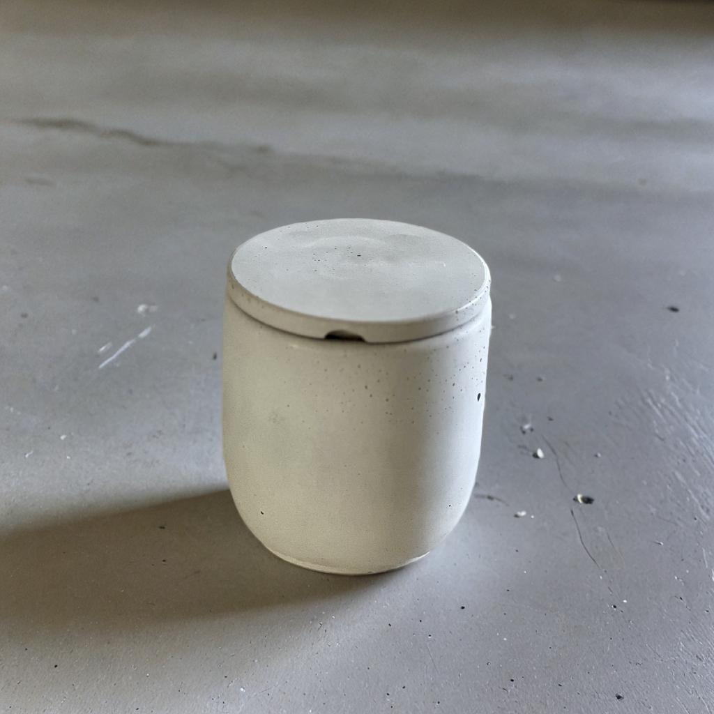 white match holder with lid set on marble countertop